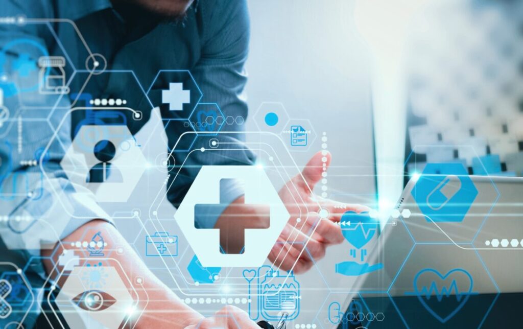 A person interacts with a digital tablet, overlaid with glowing blue hexagonal medical and data icons, symbolizing digital healthcare technology.